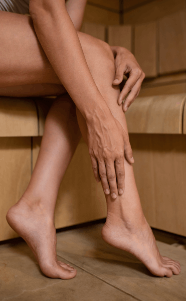 close-up-hands-touching-leg