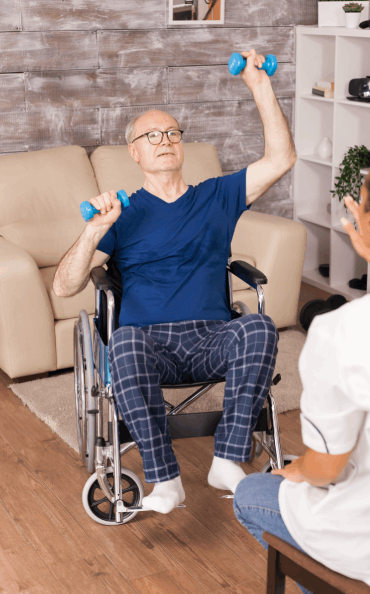 disabled-senior-man-wheelchair-training-with-dumbbells-during-rehabilitation-with-nurse (1)