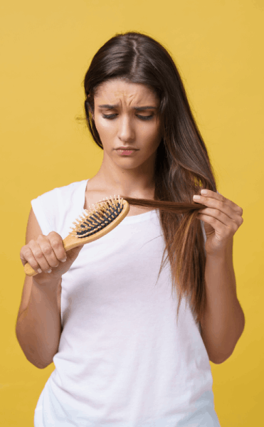 woman-hand-holding-her-long-hair-with-looking-damaged-splitting-ends-hair-care-problems